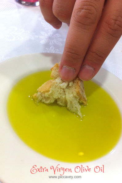 Dipping Bread in extra Virgen Olive Oil